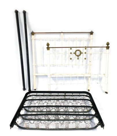 A Victorian brass and iron double bedstead.