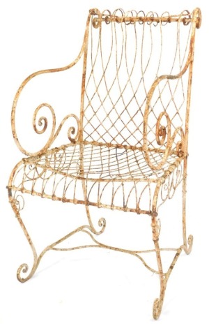 A Victorian wrought iron garden chair, with scroll framing.