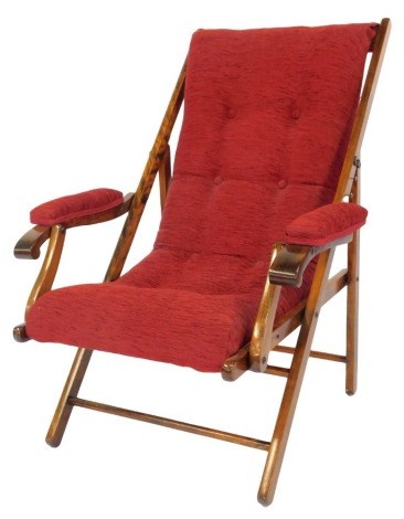 An Edwardian beech Schooner or steamer chair, with buttoned upholstery.