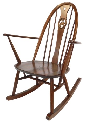 An Ercol elm and beech rocking chair, with swan splat.