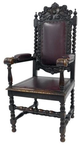 A Victorian carved oak throne chair, with barley twist supports, and studded leather upholstery, 60cm wide. (AF)