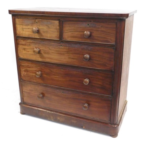 A Victorian mahogany chest, of two short and three long graduated drawers, turned drop handles, on a plinth base, 106cm high, 106cm wide, 54cm deep.