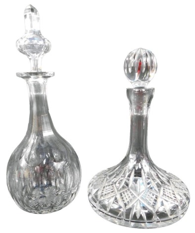 A cut glass ship's decanter and stopper, 29cm high, together with a cut glass mallet shaped decanter and stopper, 36cm high.