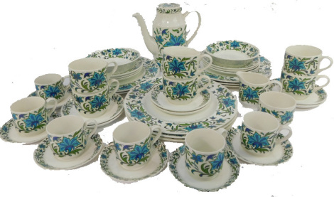 A Midwinter part coffee, tea and dinner service, each piece decorated with blue and green flowers against a white ground, comprising coffee pot, six coffee cups and six saucers, six teacups and six saucers, six side plates, eight dinner plates, sugar bowl