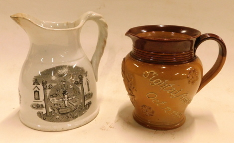 A Doulton Lambeth Christopher Columbus commemorative stoneware jug, with flared ribbed neck, and with Columbus cameo, and inscribed Christopher Columbus Sighted America October 12th 1492, 16cm high, and a 19thC pottery Masonic jug, with rope twist handle,