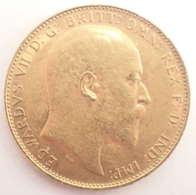 An Edward VII full gold sovereign dated 1906, 7.8g. - 2