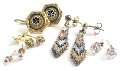 A group of earrings, comprising a pair of Eastern style drop earrings, with blue enamel decoration, yellow metal unmarked, a pair of 9ct gold knot twist earrings, 2.4g all in, and a small group of unmarked earrings. (a quantity)