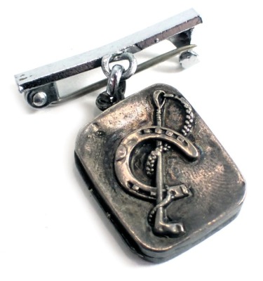 A silver horse related pendant/brooch, the small rectangular silver locket with horseshoe and riding crop, Birmingham assay, on a later single costume pin bar brooch, the pendant 1.8cm x 2.2cm.