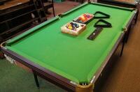 A modern 6' x 3' snooker table on folding legs.