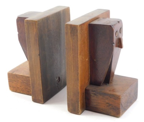 A pair of Art Deco oak bookends, each carved as owls, 12.5cm high.