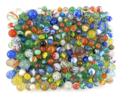 A quantity of marbles, various colours and sizes.