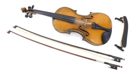 A German violin, with a two piece back, bearing label for Schuster and Co, and pencil date 150296, branded mark for Witthalm Violin to reverse, length of back 36cm, a violin bow with silver coloured mounts, stamped S Eastman, and a bow with nickel plated 