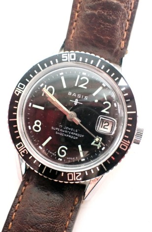 A Basis diver's watch, with seventeen jewel movement, blackened dial with glow in the dark numbered markers, date aperture with twist outer dial, on stainless steel back with brown leather strap, the dial 2.5cm diameter.