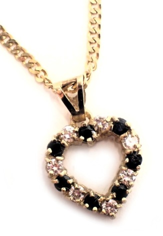 A 9ct gold pendant and chain, the heart shaped pendant set with blue and white stones, 2cm high, on fancy link chain, 46cm long, 4.6g all in.