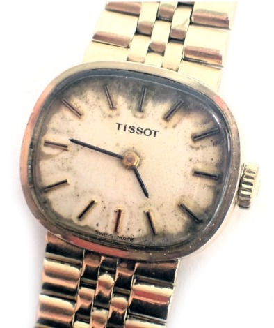 A 9ct gold Tissot wristwatch, with an oblong dial on cream face, with seventeen jewel movement, dial 2cm diameter, the watch 19cm long, 36.1g all in.