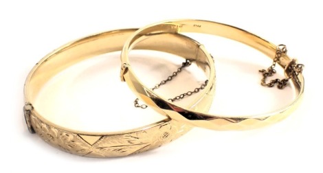 Two bangles, comprising one of engine engraved design, the other of hammered design, stamped gold filled. (2)