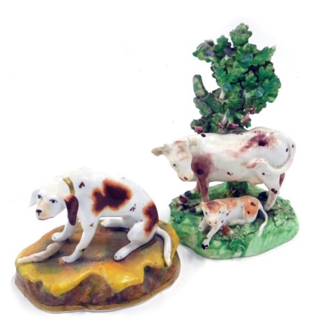 Two Staffordshire 19thC porcelain figures, to include a hound seated on a stylised mound, a bocage figure of a cow and calf. (AF)