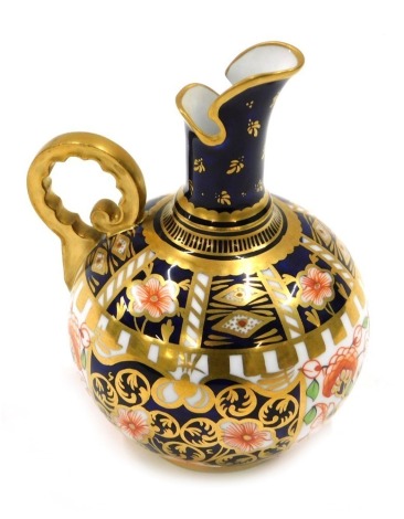 A Royal Crown Derby porcelain small ewer, decorated in Imari colours, printed marks in red to underside and pattern numbers 699 6299, 12cm high.