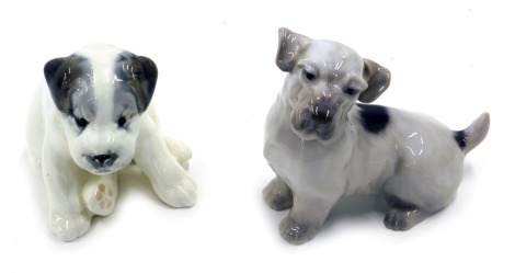 A Royal Copenhagen porcelain terrier, stylised wave mark and pattern number 1452/2621, 14cm wide, and a Russian porcelain seated puppy, 14cm wide.