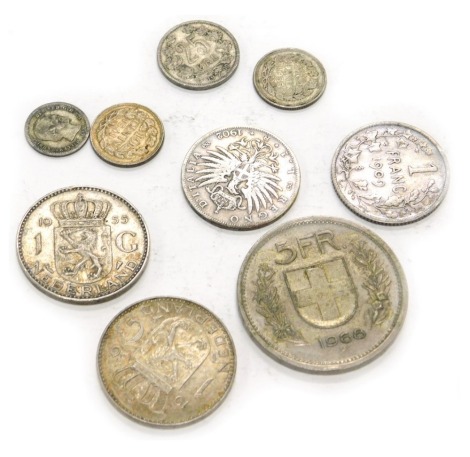 Nine various foreign coins, approximately 42g.