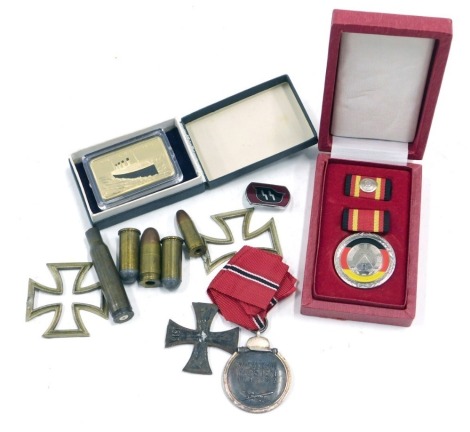 A Third Reich Eastern Front medal, dated 1941/42, an iron and cross (AF), a replica SS pin badge, Titanic medallion, etc.