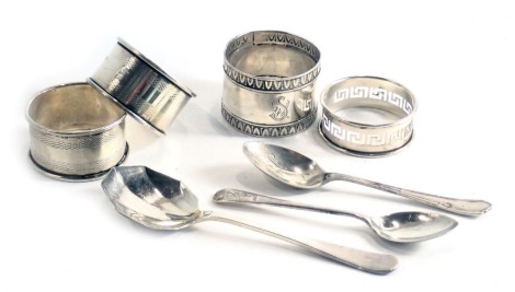 A collection of small silver, spoons and napkin rings, 33.67oz.