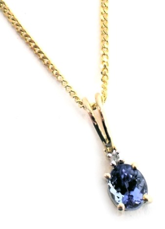 A tanzanite and diamond pendant and chain, set with oval tanzanite and round brilliant cut diamond, in a yellow gold setting stamped 14k, with certificate for 9ct gold, tanzanite 0.35ct, 1.6g all in.