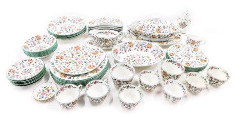 A Minton Haddon Hall pattern part tea and dinner service, comprising tureen and oval cover, six breakfast bowls, six soup bowls, six medium plates, two sugar bowls, gravy boat and saucer, milk jug, six cups and saucers, oval serving plate, and six dinner 