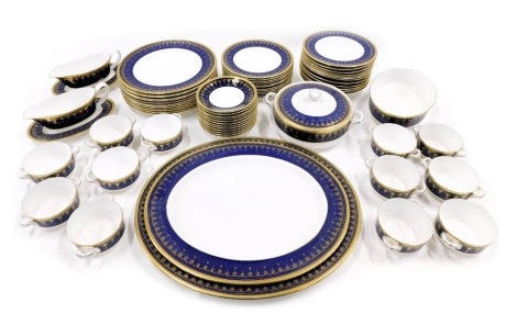 A Royal Worcester Imperial pattern part dinner and tea service, to include tureen cover, two oval meat dishes, a serving dish, two sauce boats and two stands, two handled cups, saucers, dinner plates, soup or cereal bowls, etc.