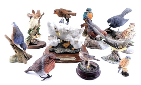 A group of animal ornaments, a mistlethrush, Country Artists Broadway Birds, Renaissance dipper, kingfisher, Country Artists robin with hair bells, and others. (1 tray)