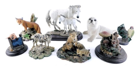 A group of animal ornaments, comprising Leonardo Collection wolf and cubs, Country Artists mouse and toadstool, Country Artist pig with sty, Cowar red fox, Country Bird Collection green woodpecker, plastic seal, and zebras. (1 tray)