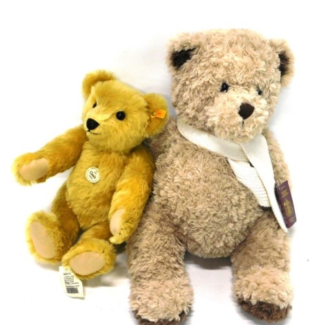 A Steiff Classic Original Teddy bear, for 1909, with label and tag, and a Playful Pals Teddy bear with passport. (2)