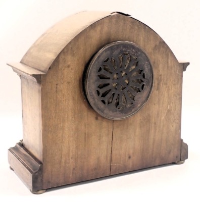 An Edwardian oak mantel clock, with arched top and boxwood tulip inlay and silvered dial, on columned supports with bun feet, thirty hour movement, 25cm high, 26cm wide. (AF) - 3