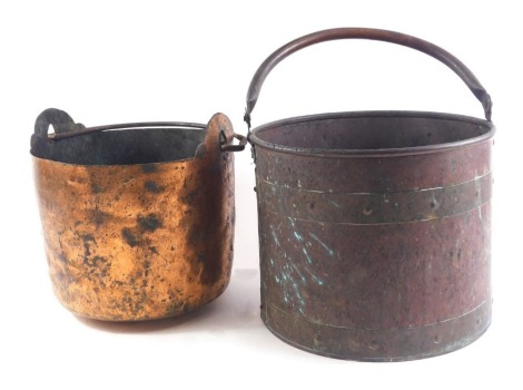 A copper and brass coal bucket, with loop handle and another similar rustic example, 29cm and 25cm diameter respectively.