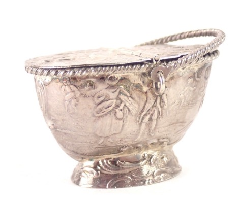 A white metal basket, with swing handle and two lift lids, with embossed figures of cherubs, with rubbed Norwegian hallmarks, 1.10oz.