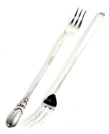 Two Danish white metal long handled forks, stamped 830.