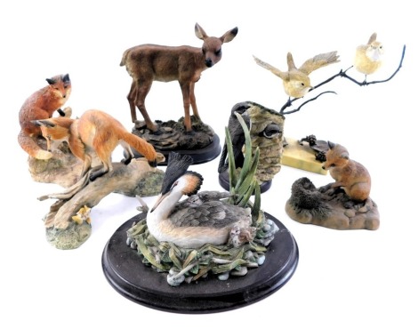 A collection of animal ornaments, comprising fox and cubs, Border Fine Arts fox on log, Border Fine Arts fox playing with hedgehog, Country Artists sand martin, and others unmarked. (1 tray)