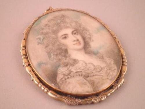 An 18thC portrait miniature of a lady wearing a dress