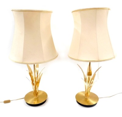 A pair of 1970s/80s gold finish table lamps, with fern sprays and later cream shades, the lamp, 52cm high.