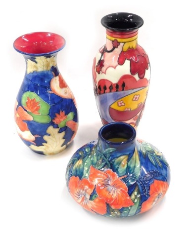 Three Old Tupton ware vases, comprising a squat vase with orange flower decoration, 10cm high, Clarice Cliff style red vase, 21cm high, and a Koi carp vase, 19cm high. (3)