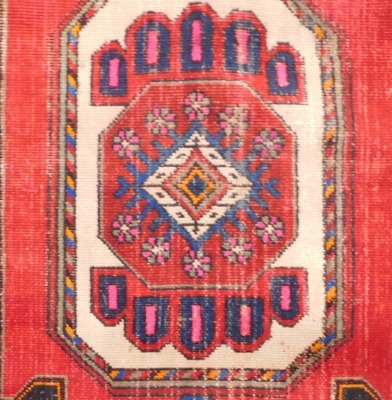 A Persian style rug, with a central medallion in red on a dark navy ground, 240cm x 135cm. - 2