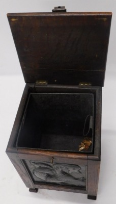 An early 20thC Arts and Crafts oak coal skuttle or box, applied with panels with hammered copper panels each side depicting roundels, squirrel, mythical beast, flower, and a bird, 34cm wide. - 2