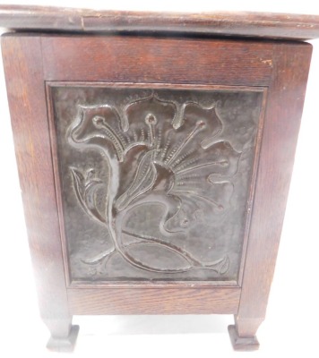 An early 20thC Arts and Crafts oak coal skuttle or box, applied with panels with hammered copper panels each side depicting roundels, squirrel, mythical beast, flower, and a bird, 34cm wide. - 3