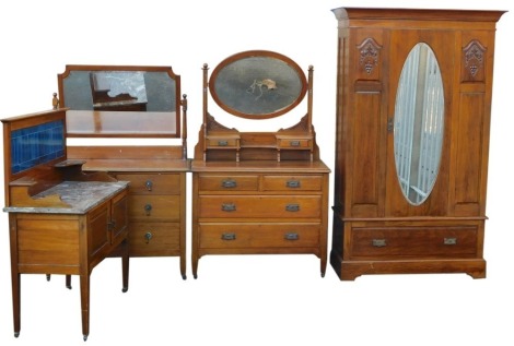 A late Victorian walnut wardrobe with single mirrored door, and drawer to base, two similar dressing tables, and a marble top wash stand.