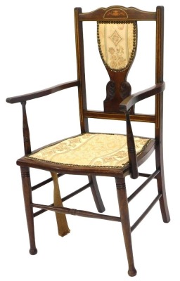 An Edwardian mahogany and marquetry open armchair, with a padded back and seat, on turned legs.