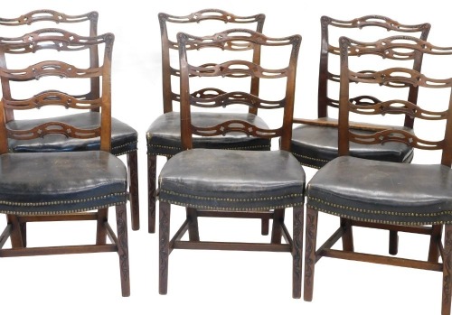 A set of six late 19th/early 20thC mahogany dining chairs, in George III style, each with a pierced ladder back, a brown brass studded leather seat, on scroll carved legs, with H stretcher.