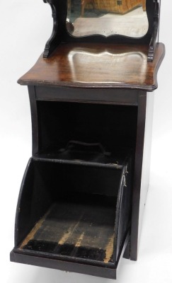 An Edwardian mahogany coal purdonium, the raised back with a shaped bevelled mirror, the base with a moulded edge and a fall front door carved with lattice design and a gilt metal handle, 38cm wide. - 2