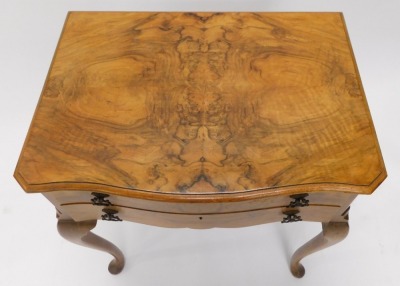 A figured walnut canteen, the serpentine fronted top with a moulded edge, above two drawers with recesses for cutlery, on cabriole legs with pad feet, 69cm wide. - 2