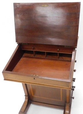 An Edwardian mahogany and satinwood banded Davenport, the raised top with a hinged recess for pens, etc., above a green leatherette mounted writing slope enclosing a fitted interior, with four drawers to the side and four false drawers, on shaped supports - 2