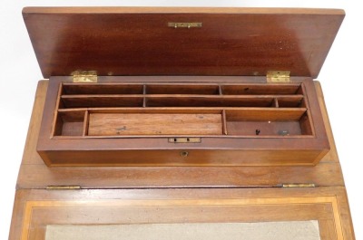 An Edwardian mahogany and satinwood banded Davenport, the raised top with a hinged recess for pens, etc., above a green leatherette mounted writing slope enclosing a fitted interior, with four drawers to the side and four false drawers, on shaped supports - 3